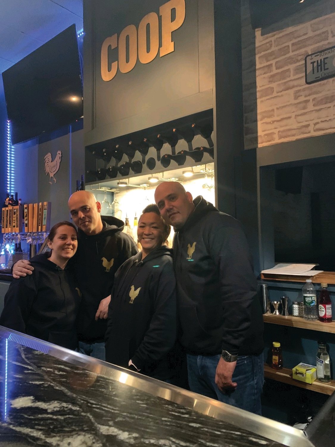 COOP PROPRIETORS: In just a few month, Melisa and Robert Ferruolo, Tonya Antonelli and Mathew Ferruolo have created quite the unique eating and drinking experience inside The Chicken Coop Kitchen and Bar at 1463 Atwood Ave. in Johnston.